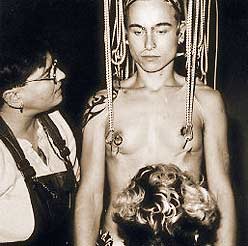 Idexa is pierced and rigged for her vertical suspension by Raelyn Gallina.