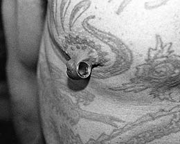 Alan Oversby's stretched nipple piercing (Mr. Sebastian).