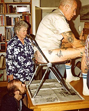 Elizabeth Weinzirl looks on.
