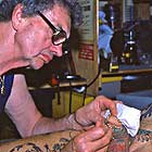 Doug Malloy giving Sailor Sid an apadravya